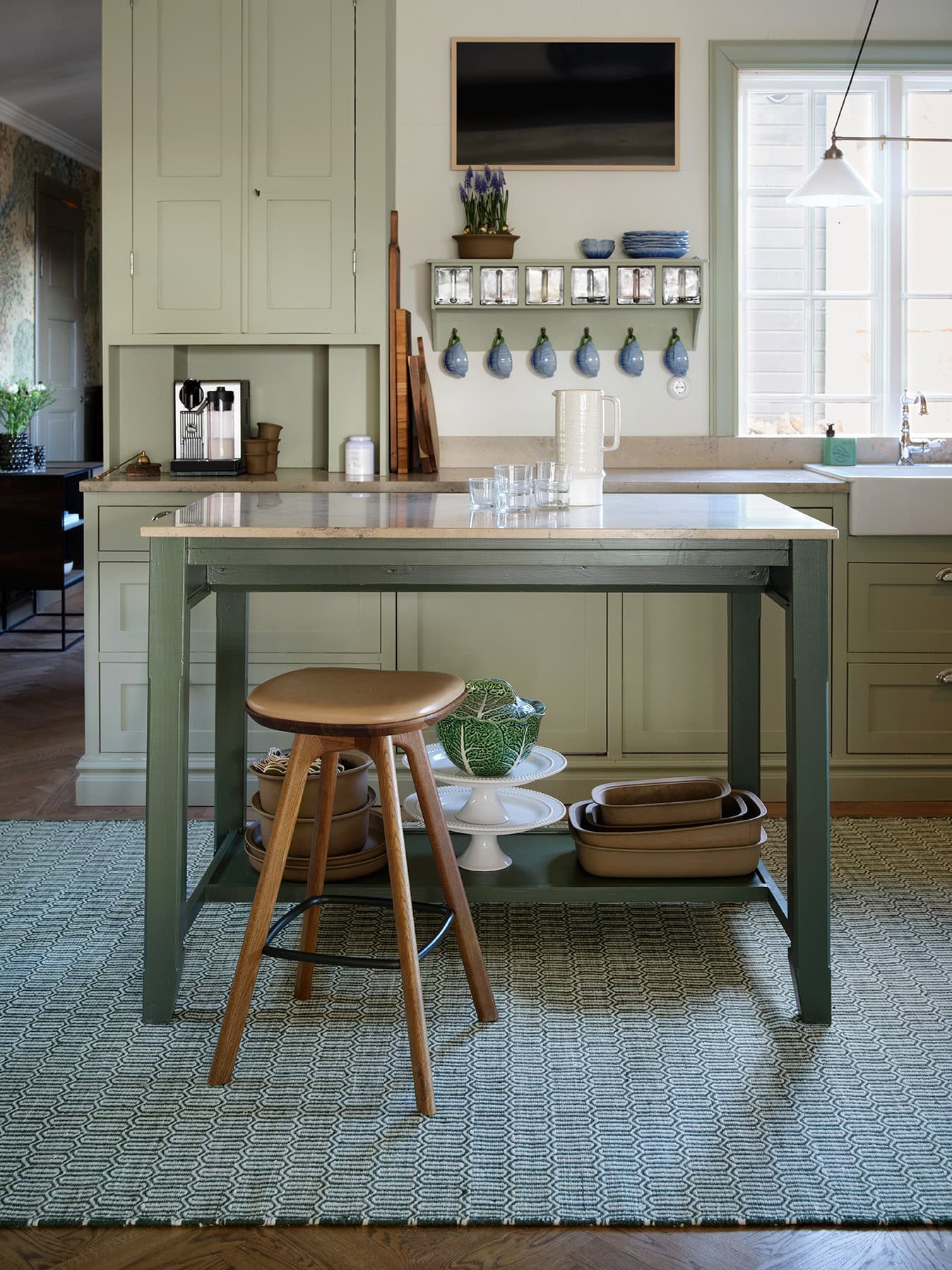 Green wool rug Mohini on kitchen floor 