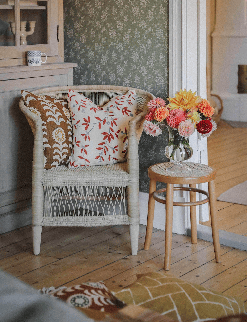 Throw pillows in a floral pattern for armchairs and stools